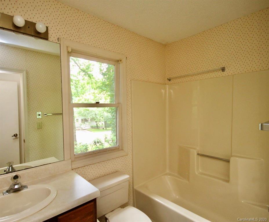 10 Dwarf Mountain Road, Unit 22 Sapphire, NC 28774 - Photo 15 of 23 a bathroom with a sink toilet and shower