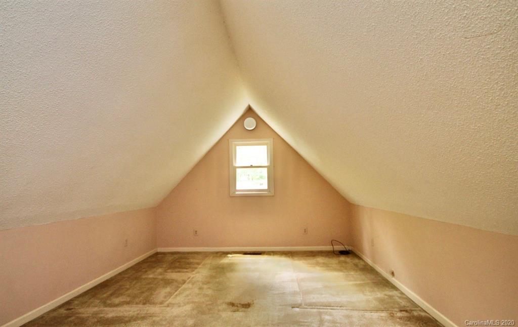 10 Dwarf Mountain Road, Unit 22 Sapphire, NC 28774 - Photo 18 of 23 a view of an empty room and window
