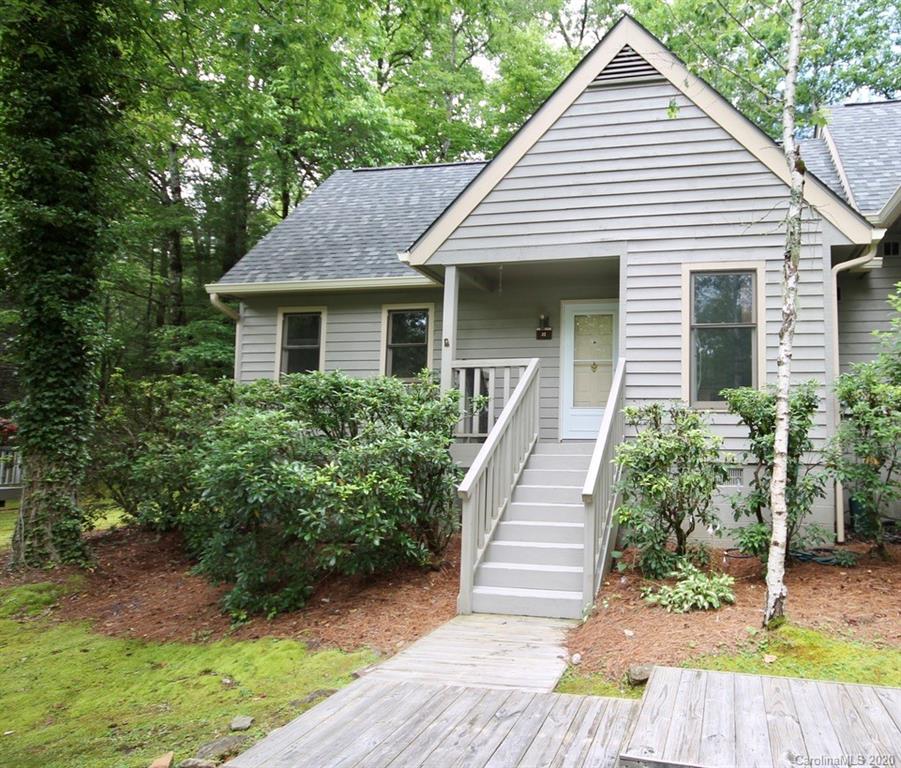 10 Dwarf Mountain Road, Unit 22 Sapphire, NC 28774 - Photo 3 of 23 a front view of a house with a yard
