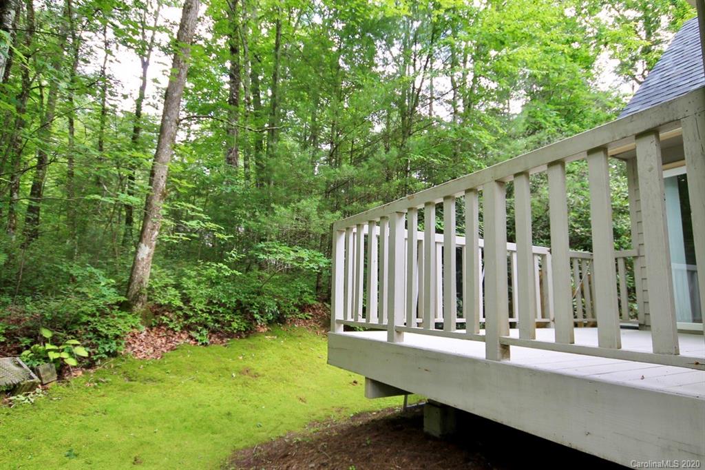 10 Dwarf Mountain Road, Unit 22 Sapphire, NC 28774 - Photo 22 of 23 a view of two chairs with wooden fence