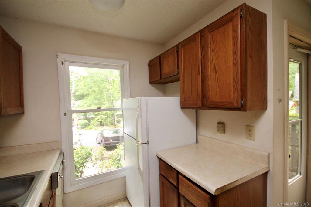 10 Dwarf Mountain Road, Unit 22 Sapphire, NC 28774 - Photo 5 of 23 a room with a window a sink and a refrigerator