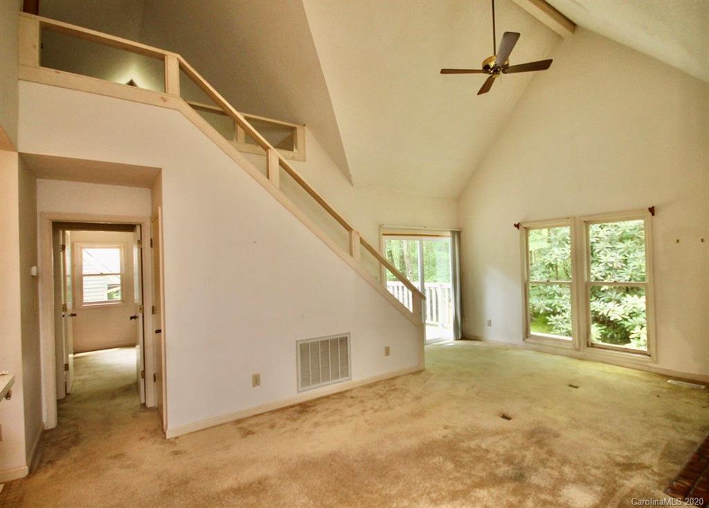 10 Dwarf Mountain Road, Unit 22 Sapphire, NC 28774 - Photo 8 of 23 a view of a livingroom with a staircase