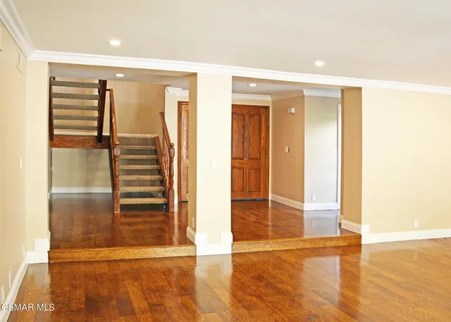 a view of entryway with wooden floor