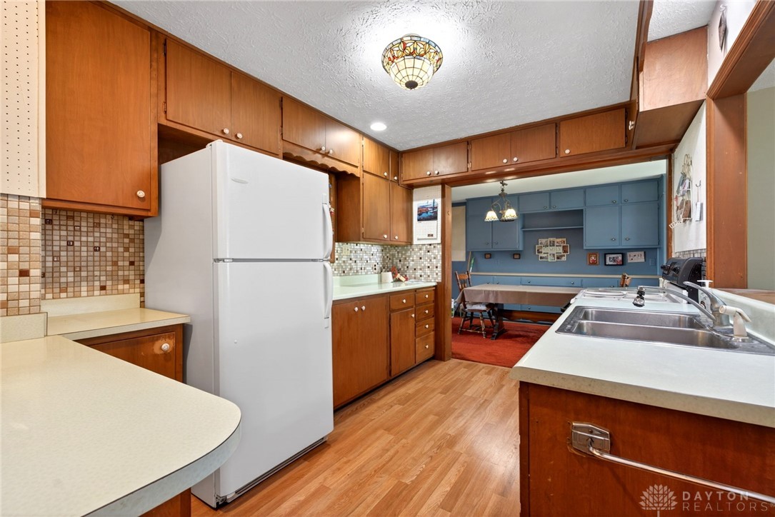 2470 Clark Run Road Xenia, OH 45385 - Photo 56 of 57 This functional kitchen features ample cabinetry and flows into a bright dining area.