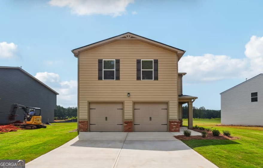 a front view of a house with a yard