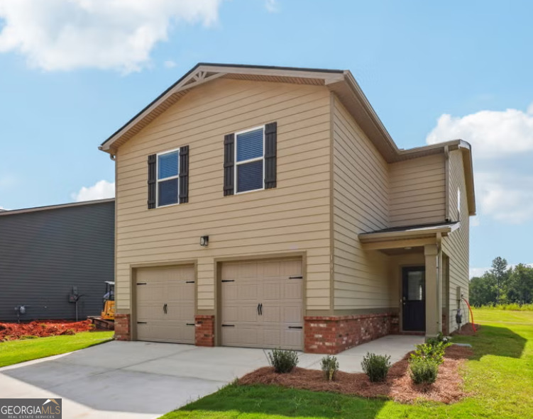 107 Garden Walk West Point, GA 31833 - Photo 2 of 9 a front view of house with yard