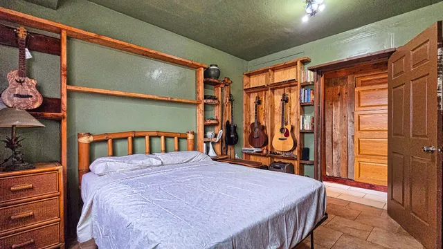 a bed room with a bed and a window