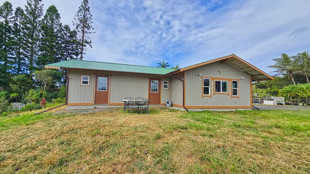 a house with trees in the background