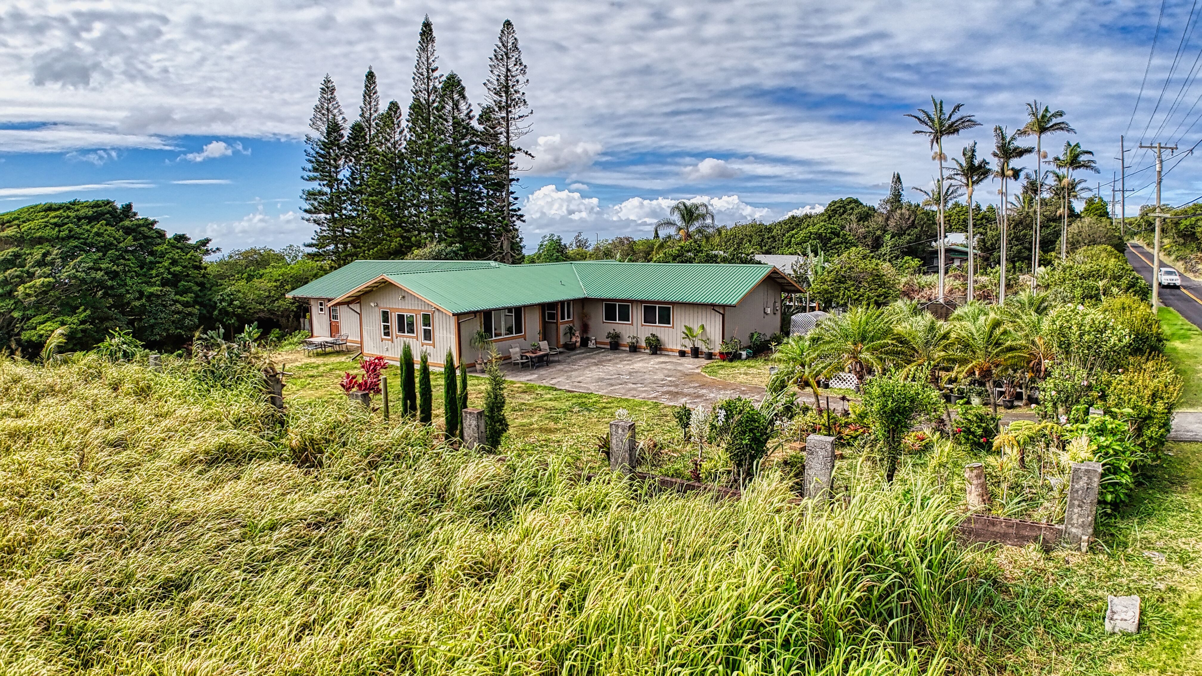 94-6491 Kamaoa Road Naalehu, HI 96772 - Photo 27 of 30 a front view of a house with a yard
