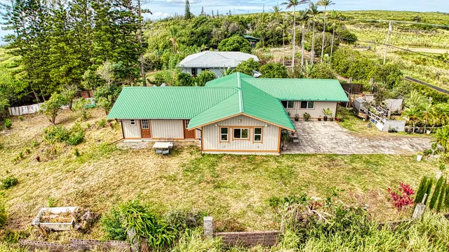 a house with swimming pool in front of it