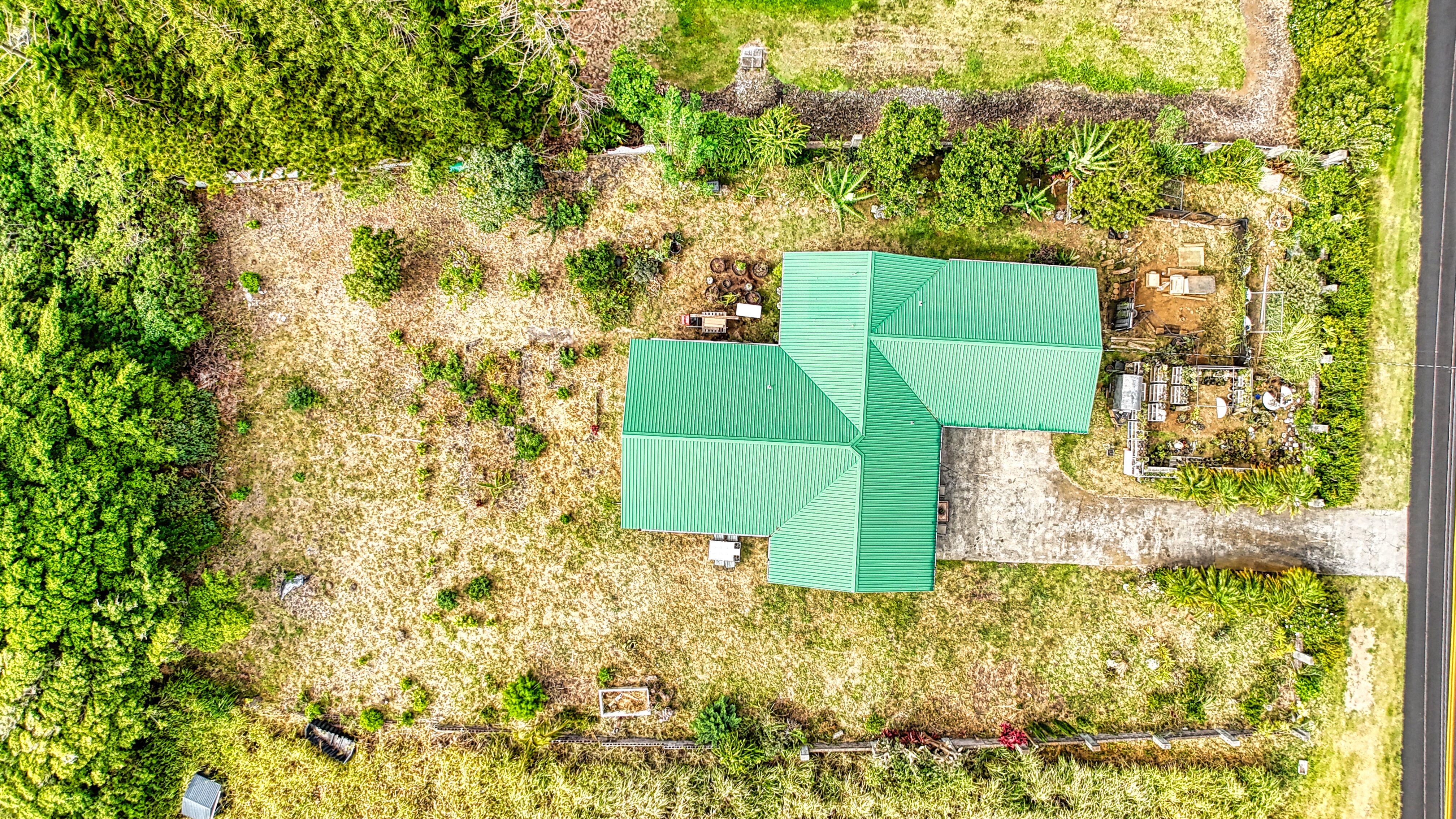 94-6491 Kamaoa Road Naalehu, HI 96772 - Photo 3 of 30 view of a yard with table and chairs