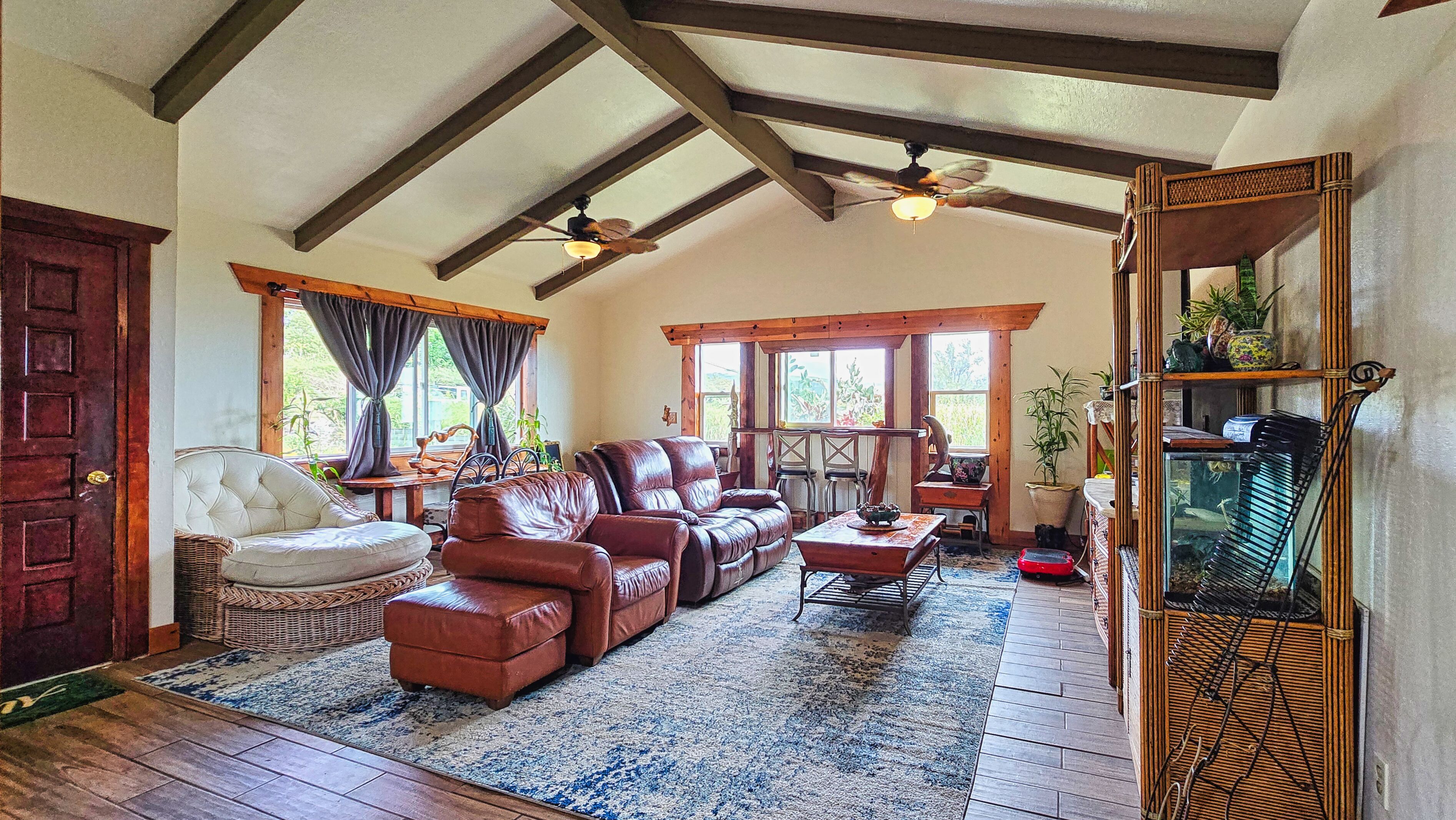 94-6491 Kamaoa Road Naalehu, HI 96772 - Photo 4 of 30 a living room with furniture or couch and a table