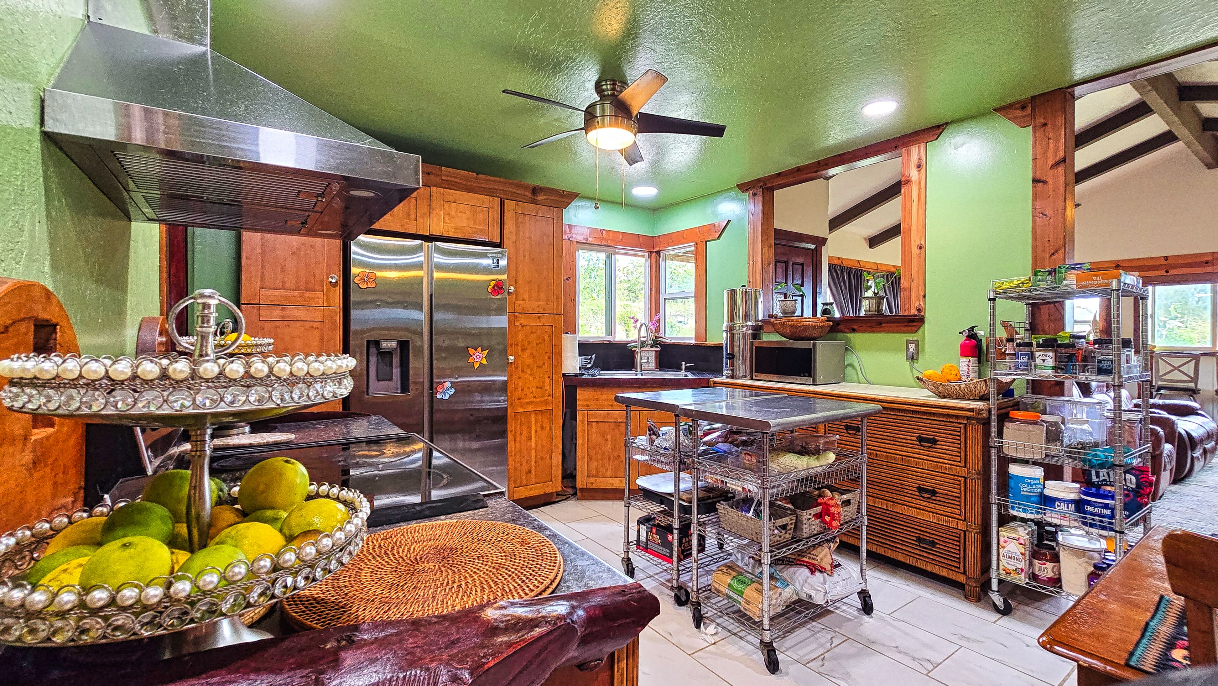 94-6491 Kamaoa Road Naalehu, HI 96772 - Photo 5 of 30 a view of a chairs and tables in a room