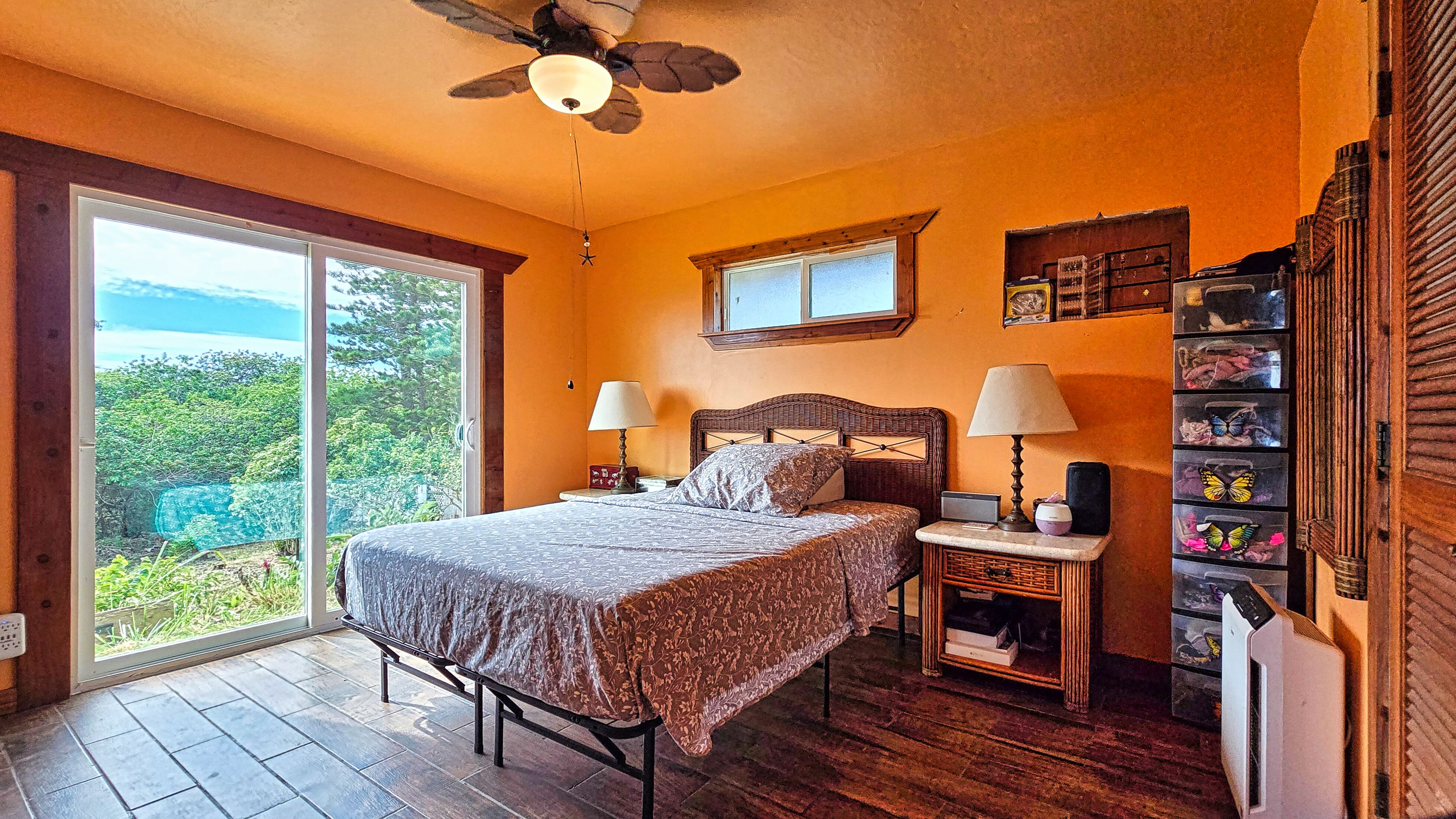 94-6491 Kamaoa Road Naalehu, HI 96772 - Photo 8 of 30 a bedroom with a bed and a window