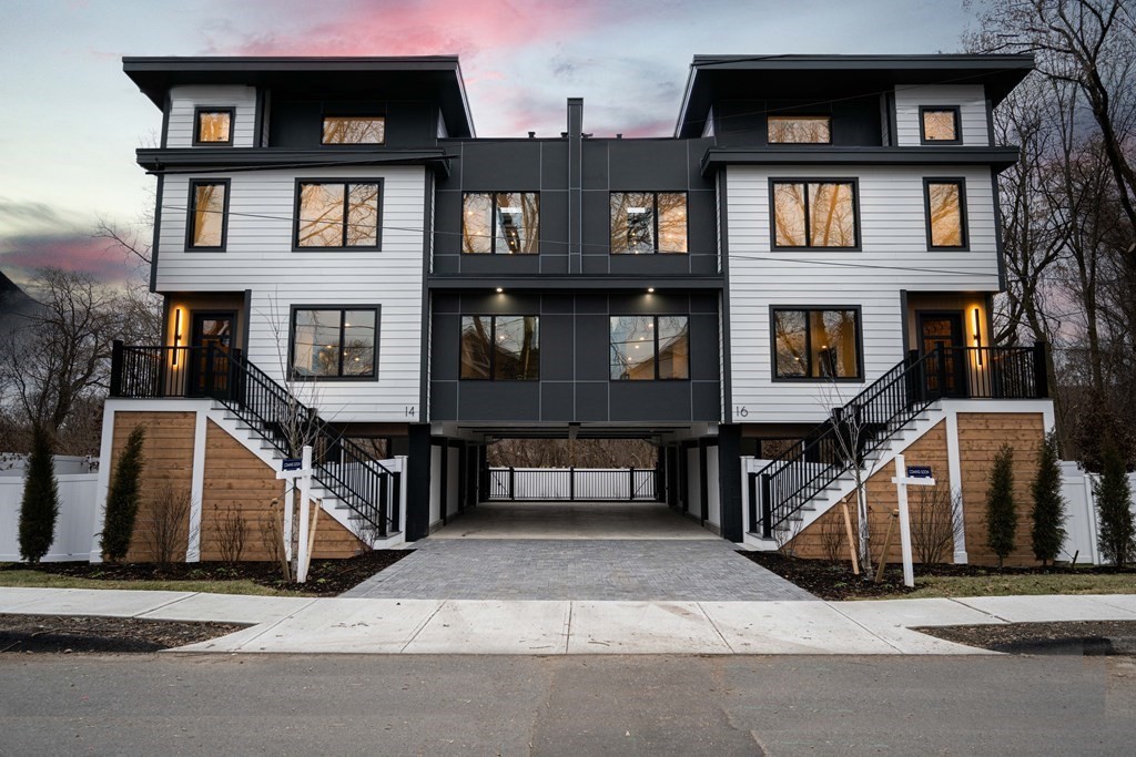 14 Edith Street, Unit 14 Arlington, MA 02474 - Photo 1 of 42 a front view of a house with a garage