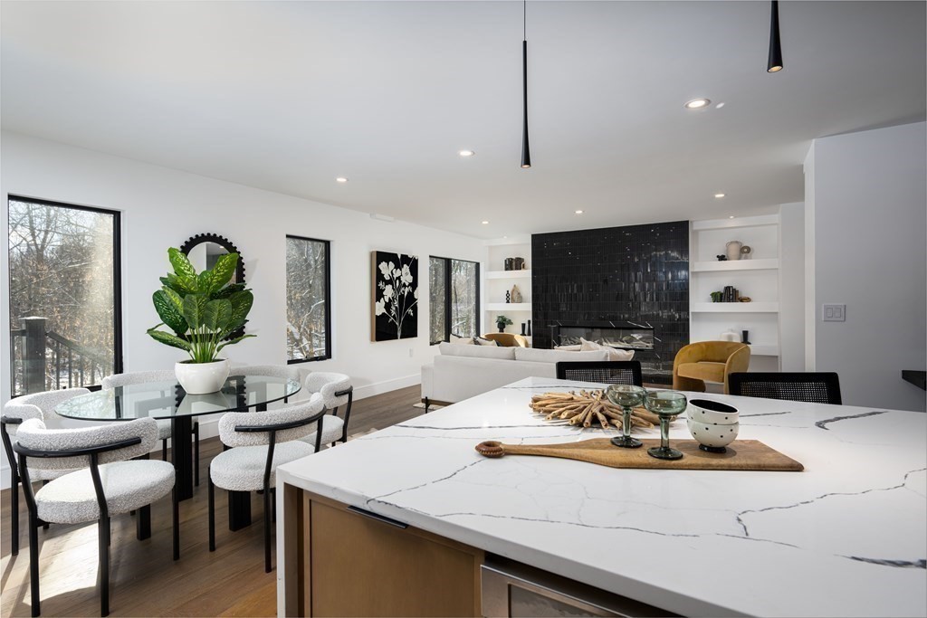 14 Edith Street, Unit 14 Arlington, MA 02474 - Photo 13 of 42 a living room with fireplace furniture and a flat screen tv