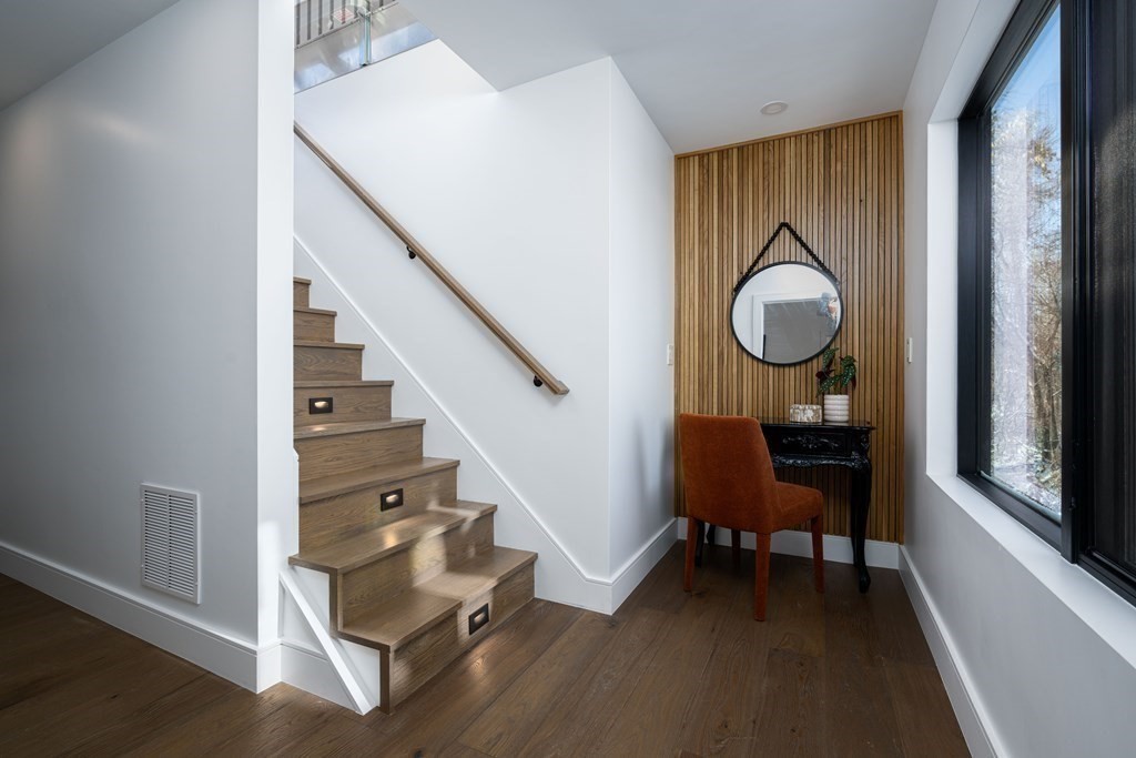 14 Edith Street, Unit 14 Arlington, MA 02474 - Photo 27 of 42 a living room with table chairs and a window
