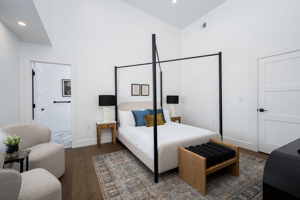 14 Edith Street, Unit 14 Arlington, MA 02474 - Photo 28 of 42 a bedroom with bed and a couch