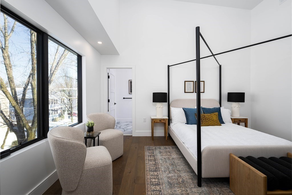 14 Edith Street, Unit 14 Arlington, MA 02474 - Photo 29 of 42 a living room with furniture and a large window