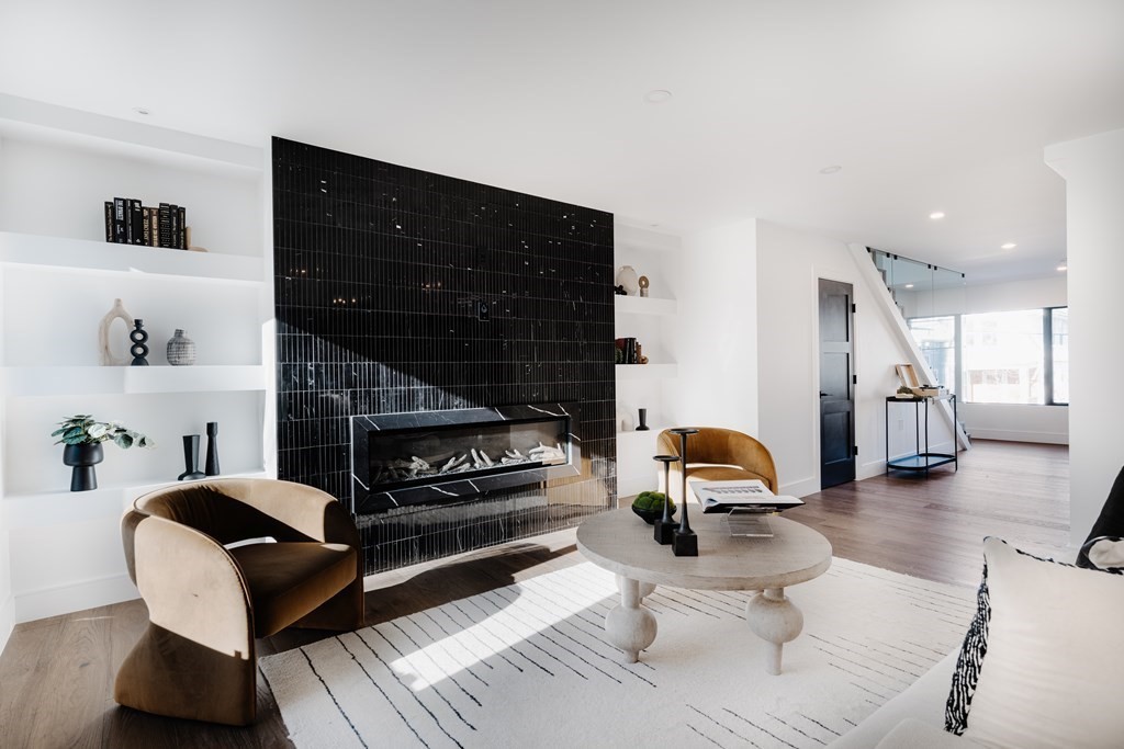 14 Edith Street, Unit 14 Arlington, MA 02474 - Photo 3 of 42 a living room with furniture and a fireplace