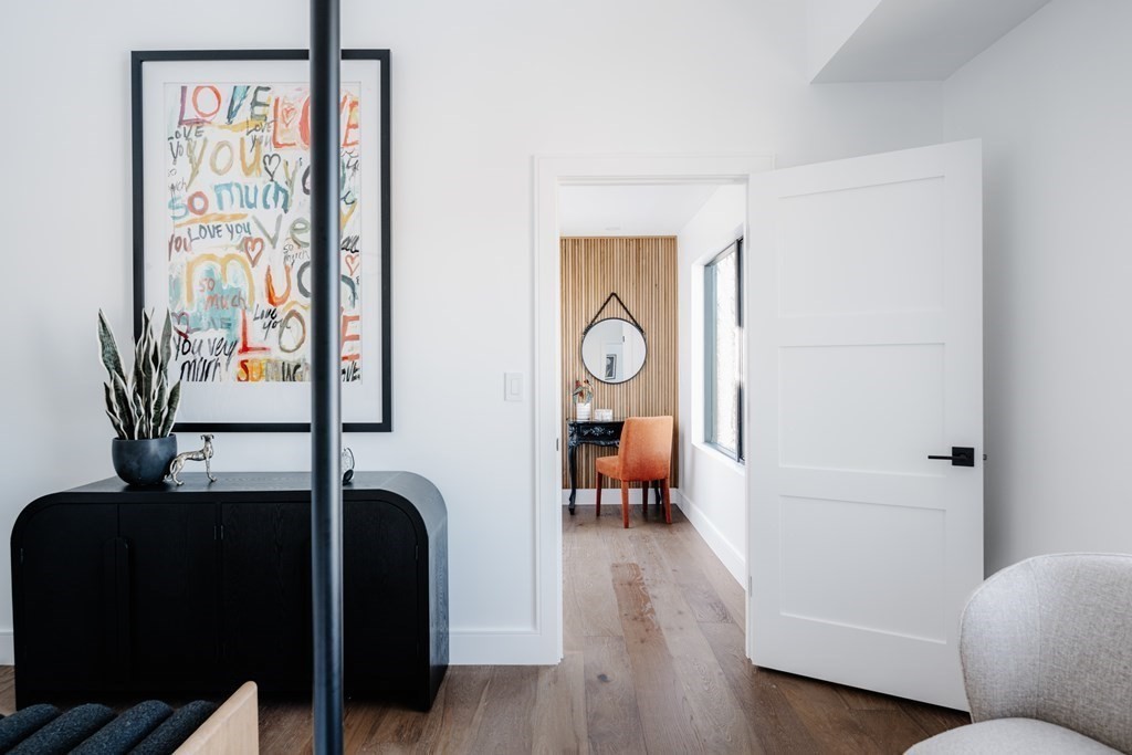 14 Edith Street, Unit 14 Arlington, MA 02474 - Photo 31 of 42 a living room with furniture and wooden floor