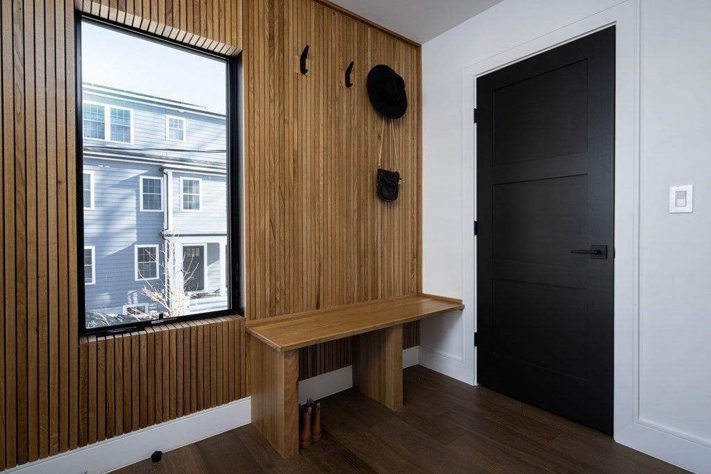 14 Edith Street, Unit 14 Arlington, MA 02474 - Photo 36 of 42 a view of a hallway with wooden door