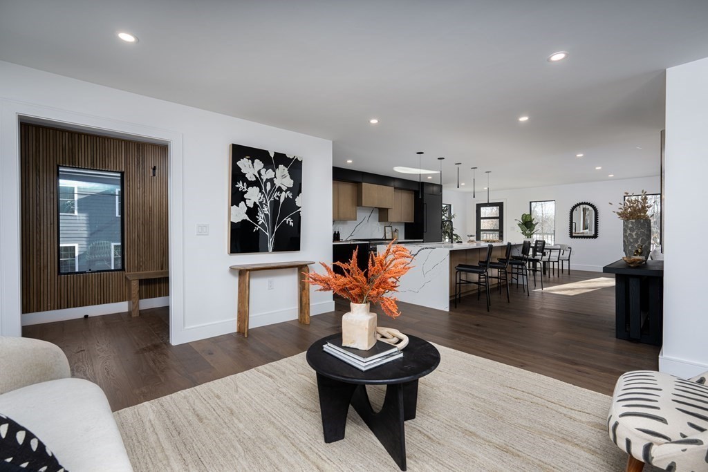 14 Edith Street, Unit 14 Arlington, MA 02474 - Photo 6 of 42 a living room with furniture and a wooden floor