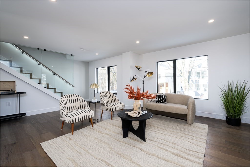 14 Edith Street, Unit 14 Arlington, MA 02474 - Photo 7 of 42 a living room with furniture and wooden floor