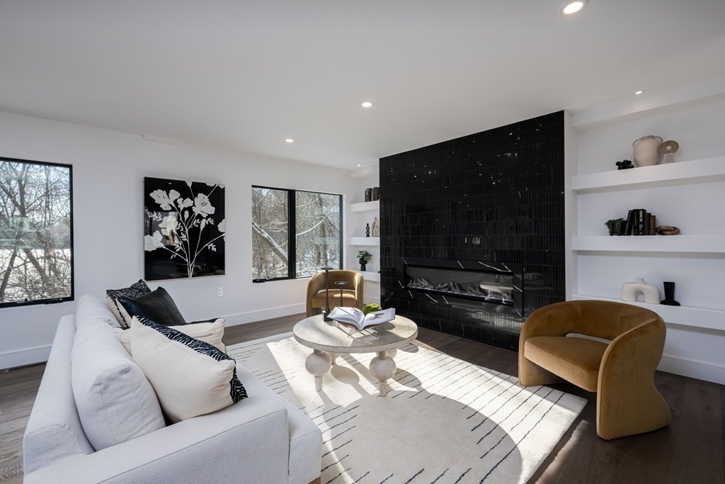 14 Edith Street, Unit 14 Arlington, MA 02474 - Photo 8 of 42 a living room with furniture and a flat screen tv