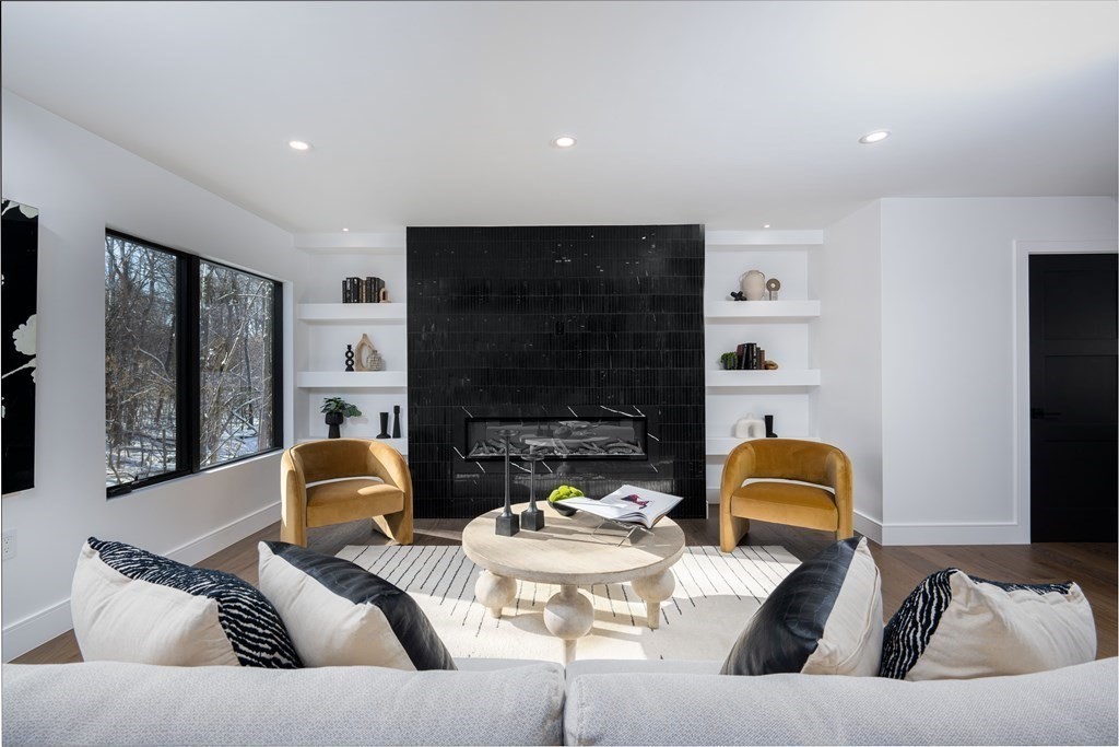 14 Edith Street, Unit 14 Arlington, MA 02474 - Photo 9 of 42 a living room with furniture and a fireplace