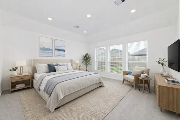a bedroom with a bed and glass windows