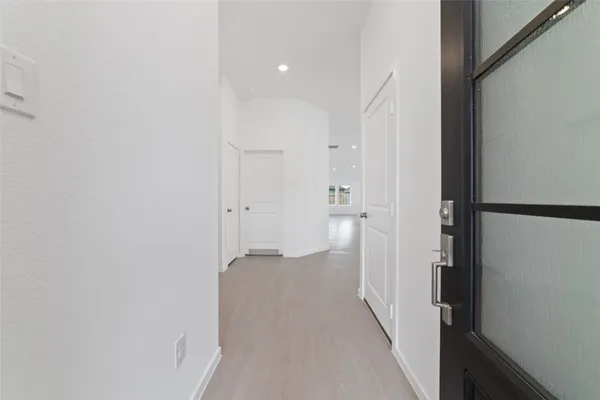 a view of a bathroom from a hallway