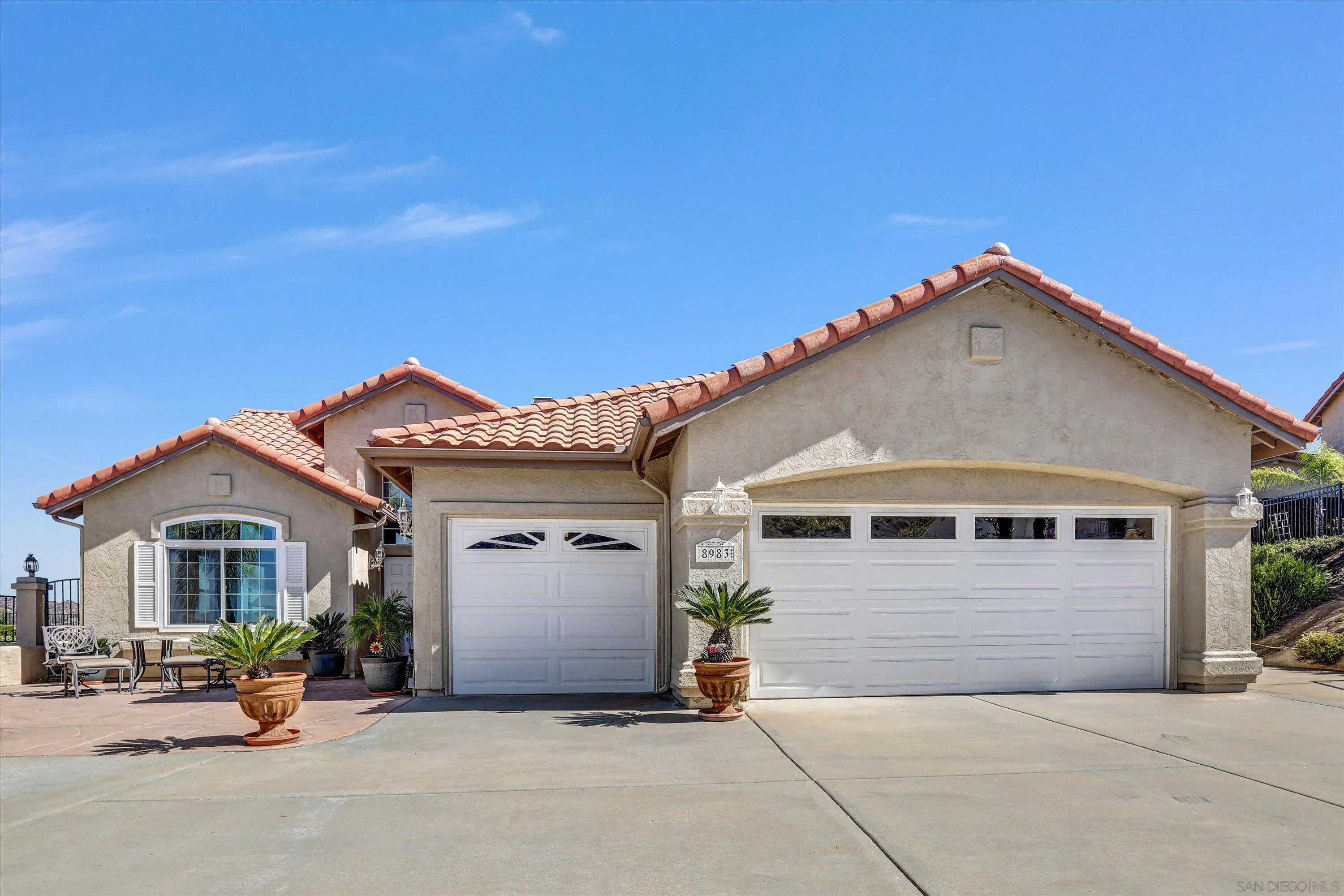 a front view of a house with garage