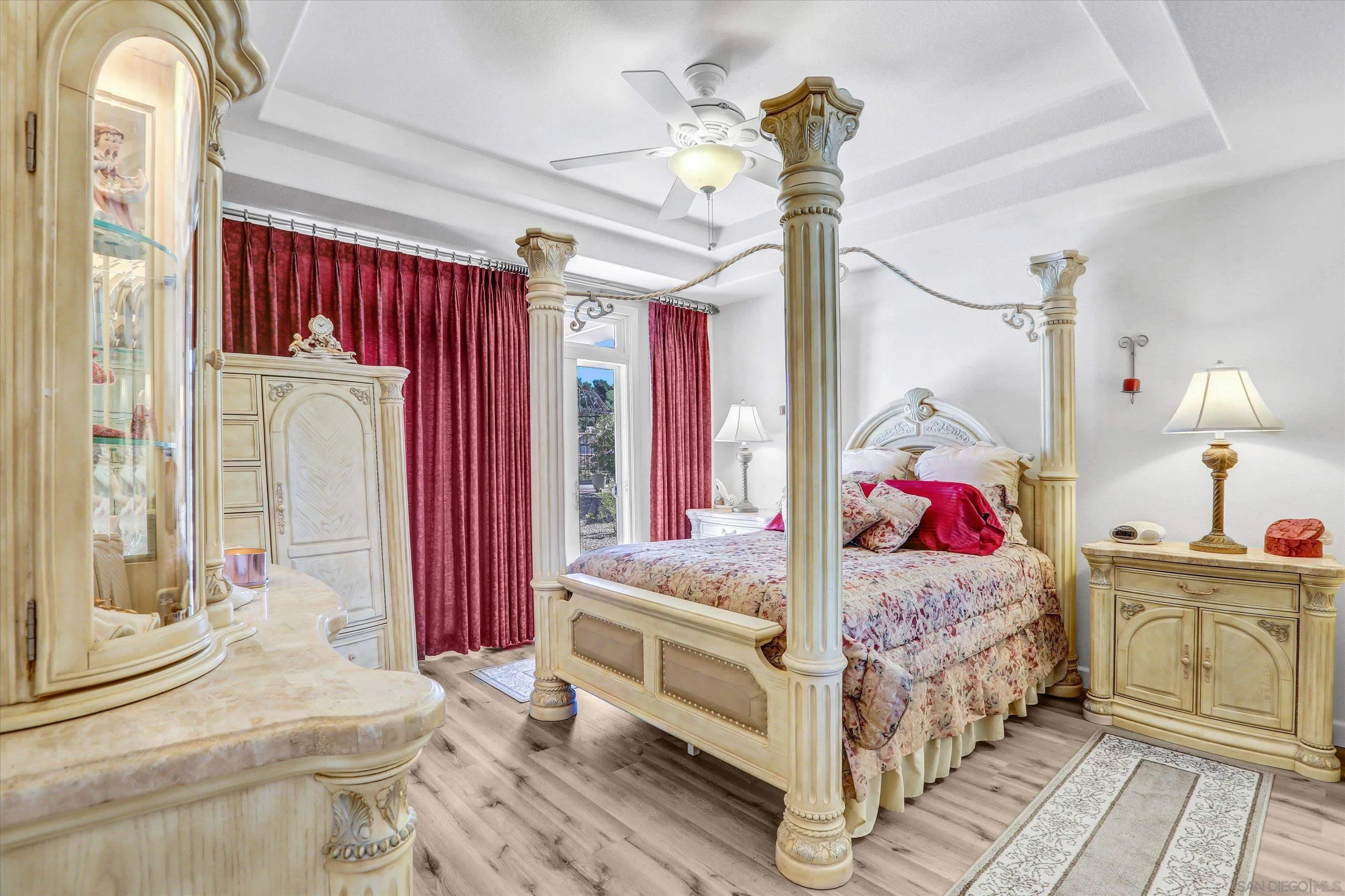 8983 Chestnut Roan Way Alpine, CA 91901 - Photo 20 of 33 a bedroom with a bed and a chandelier