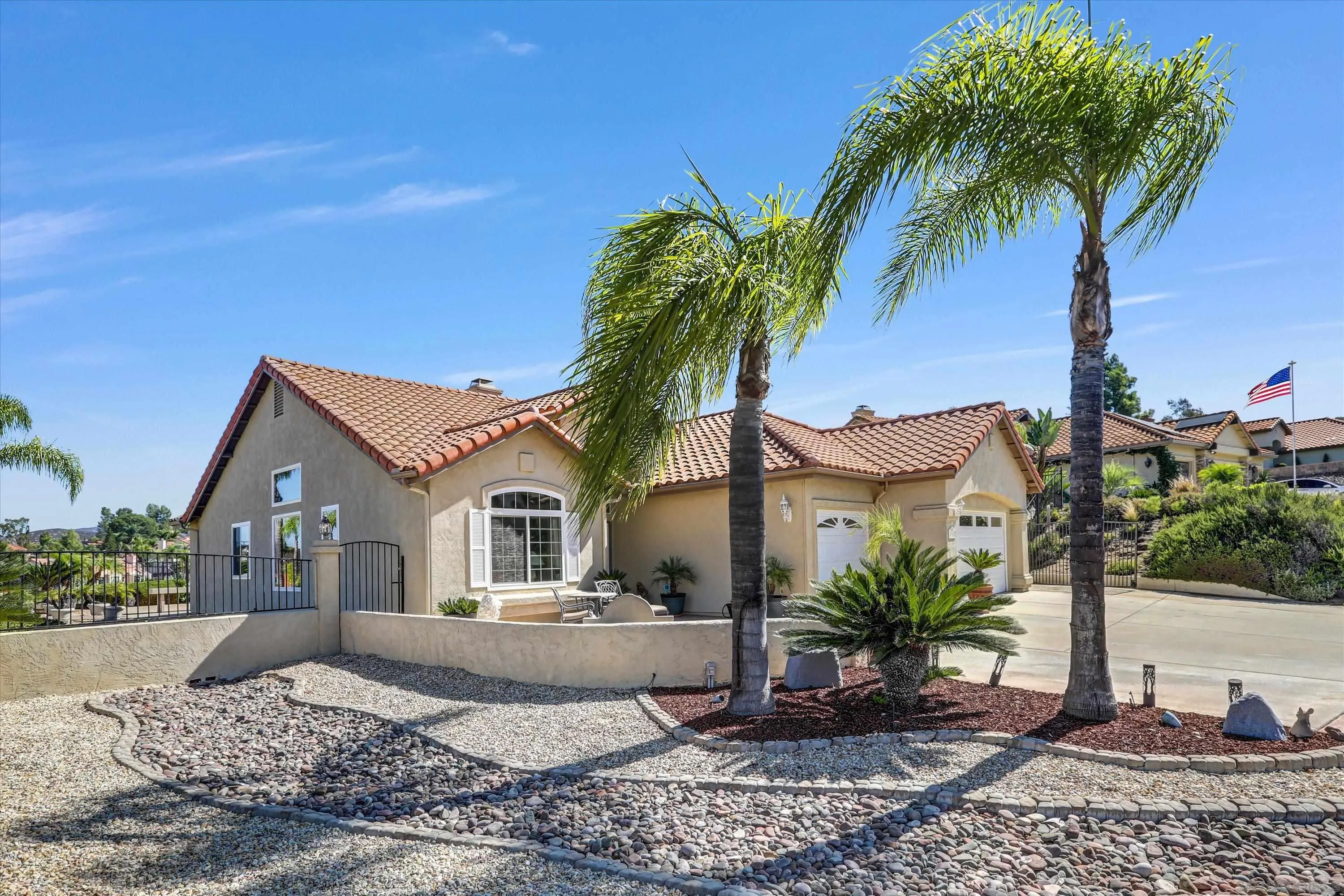 8983 Chestnut Roan Way Alpine, CA 91901 - Photo 2 of 33 a front view of a house with garden