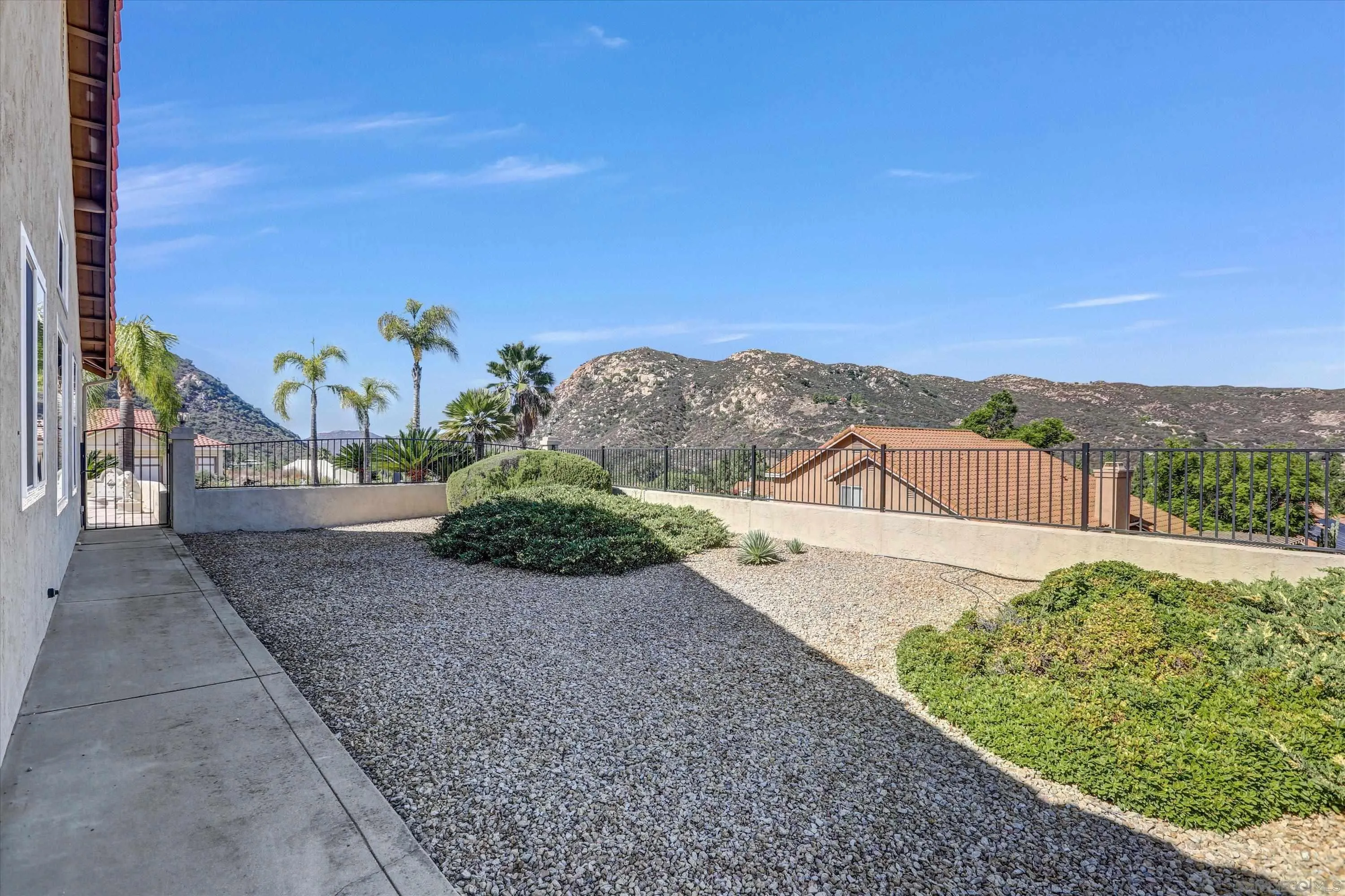 8983 Chestnut Roan Way Alpine, CA 91901 - Photo 27 of 33 a view of a street with a big yard