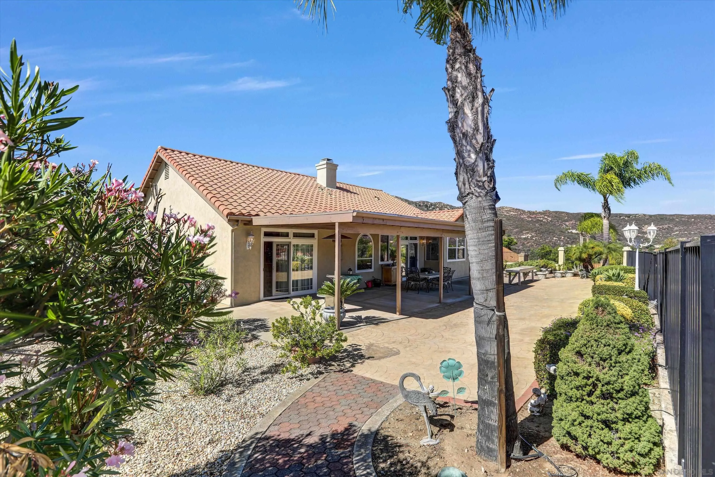 8983 Chestnut Roan Way Alpine, CA 91901 - Photo 30 of 33 a view of a house with a yard and balcony