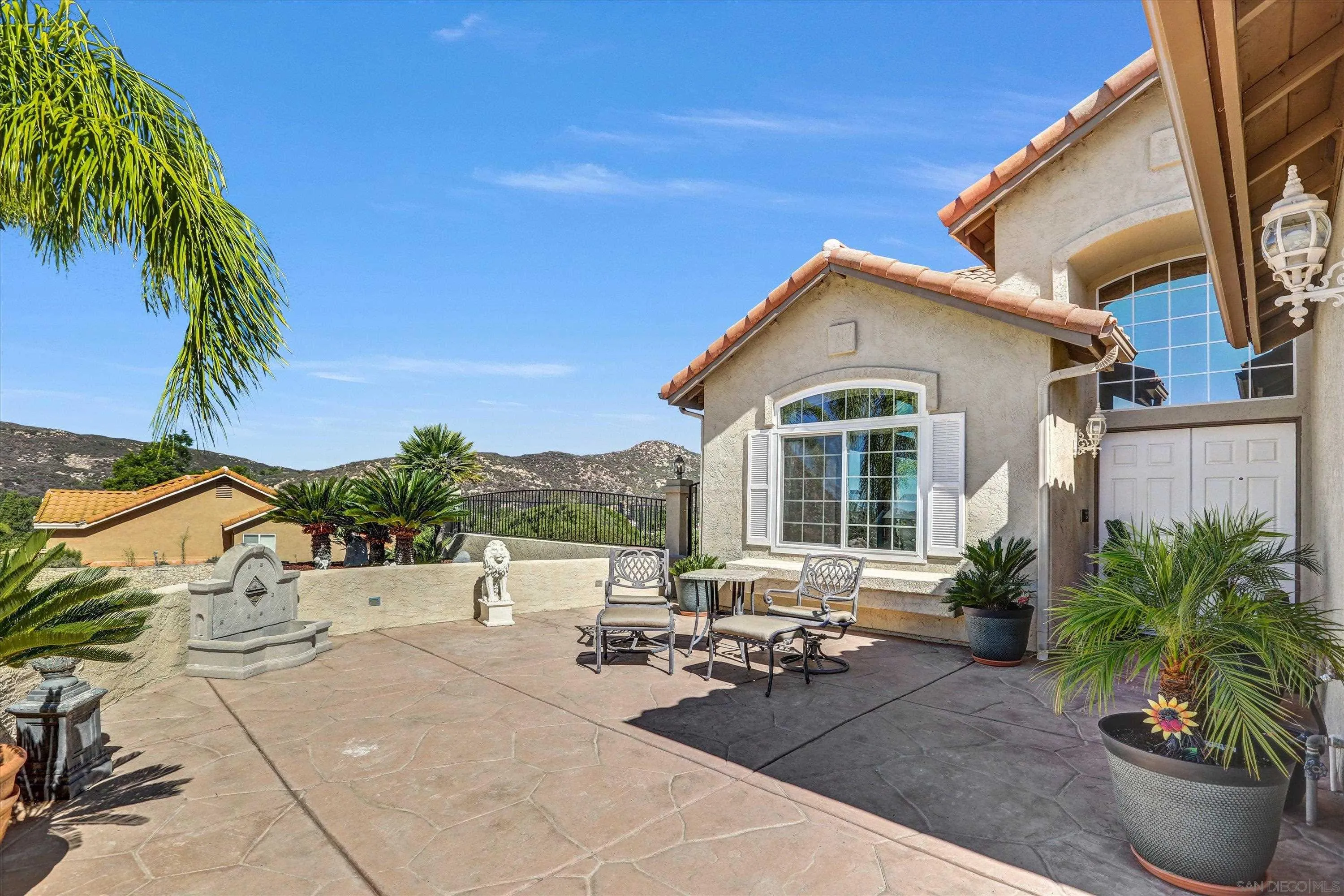 8983 Chestnut Roan Way Alpine, CA 91901 - Photo 3 of 33 a view of a patio with couches and potted plants