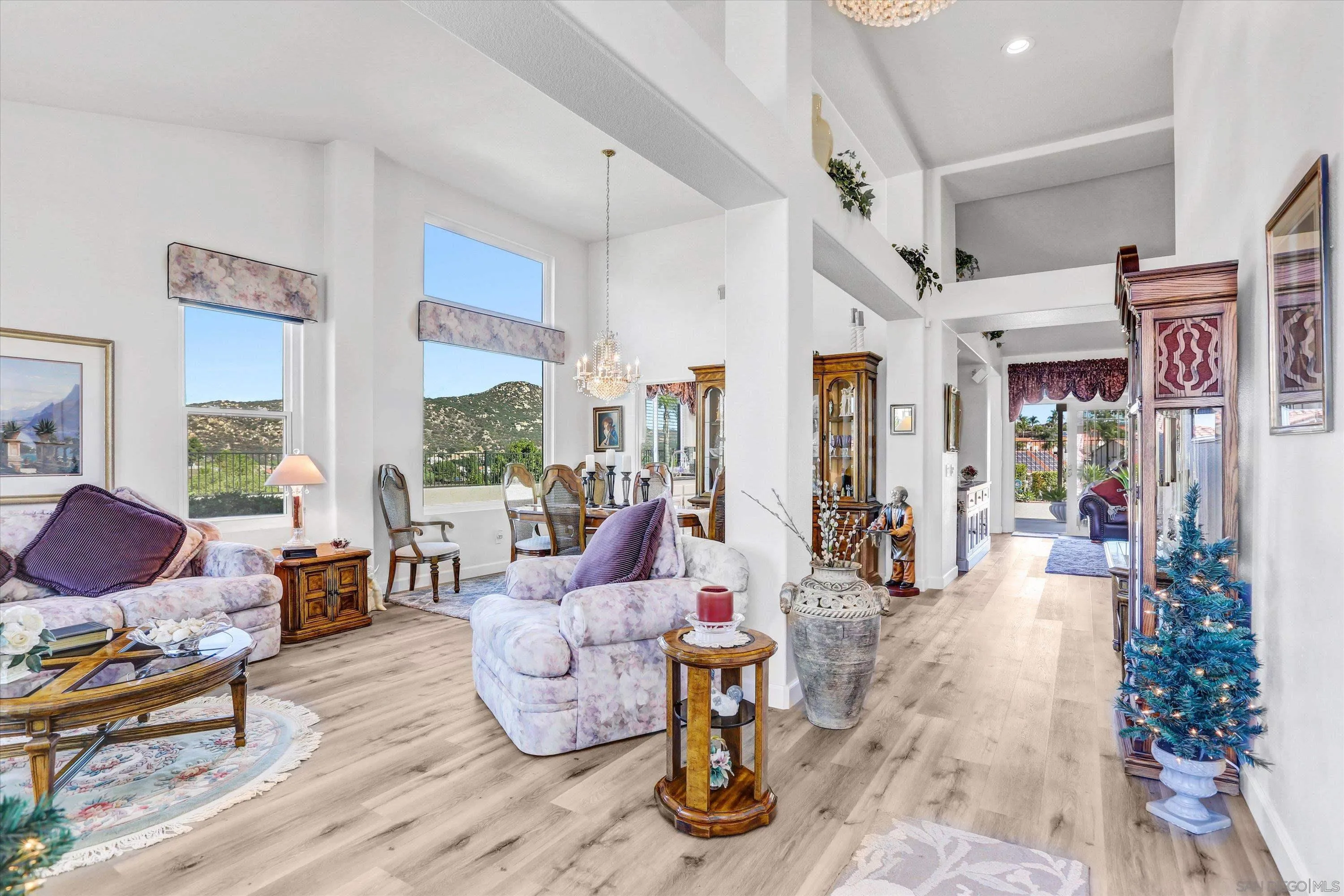8983 Chestnut Roan Way Alpine, CA 91901 - Photo 4 of 33 a living room with furniture large window and wooden floor
