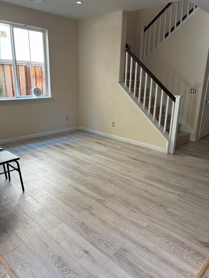 2289 Rutland Court Fairfield, CA 94533 - Photo 3 of 4 a view of an empty room with wooden floor and a window