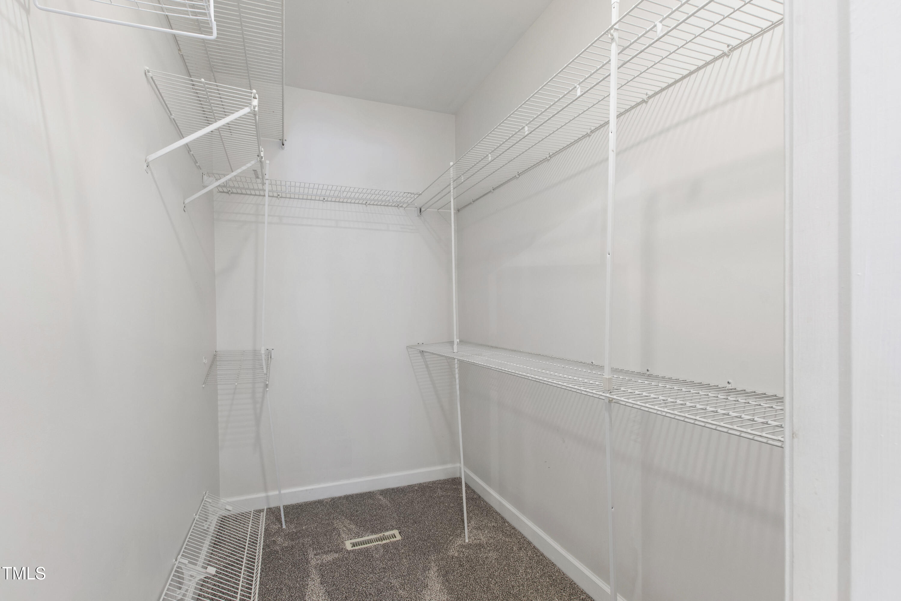 2517 High Ridge Drive Raleigh, NC 27606 - Photo 29 of 69 a view of walk in closet with empty racks