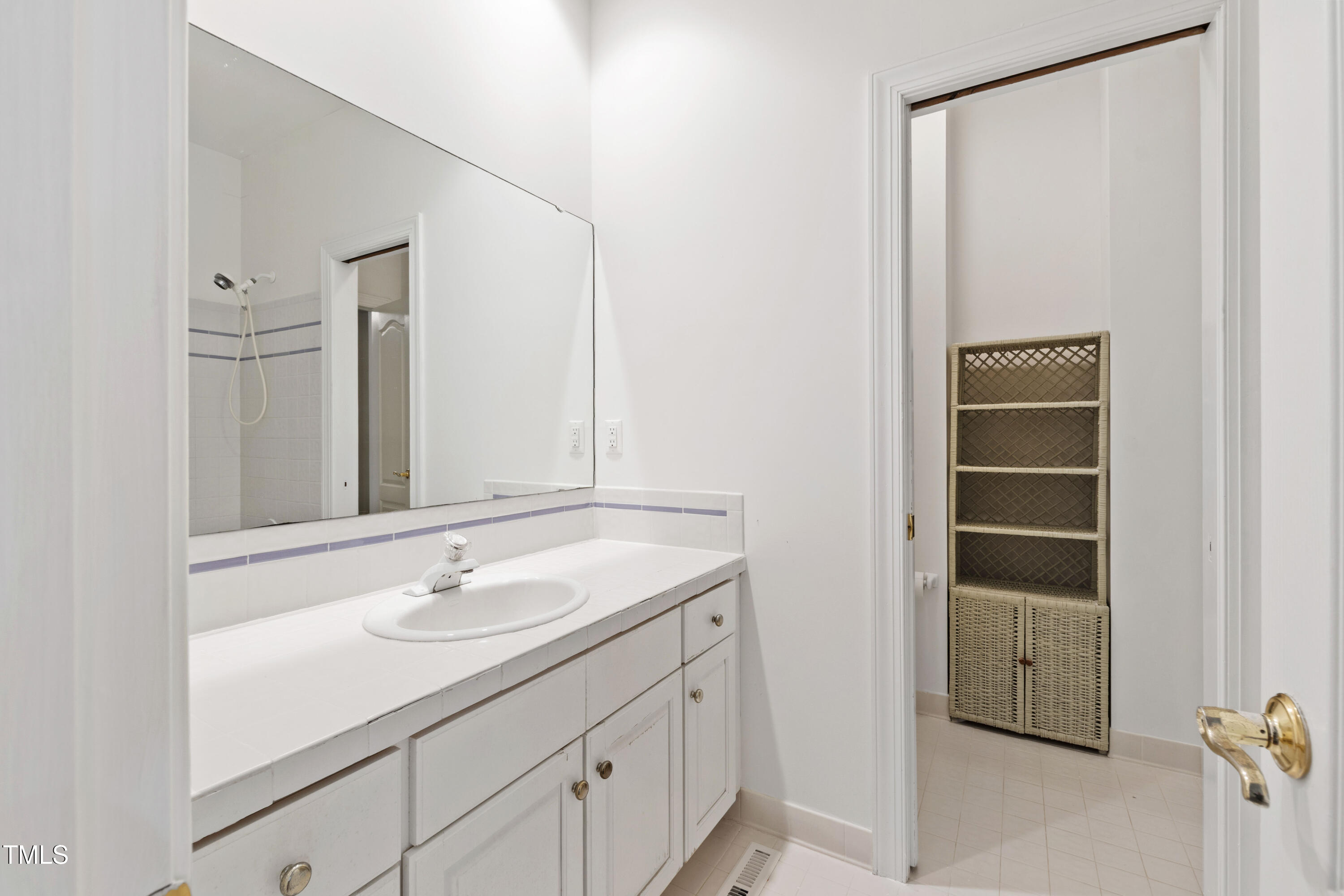 2517 High Ridge Drive Raleigh, NC 27606 - Photo 39 of 69 a bathroom with a sink and a mirror