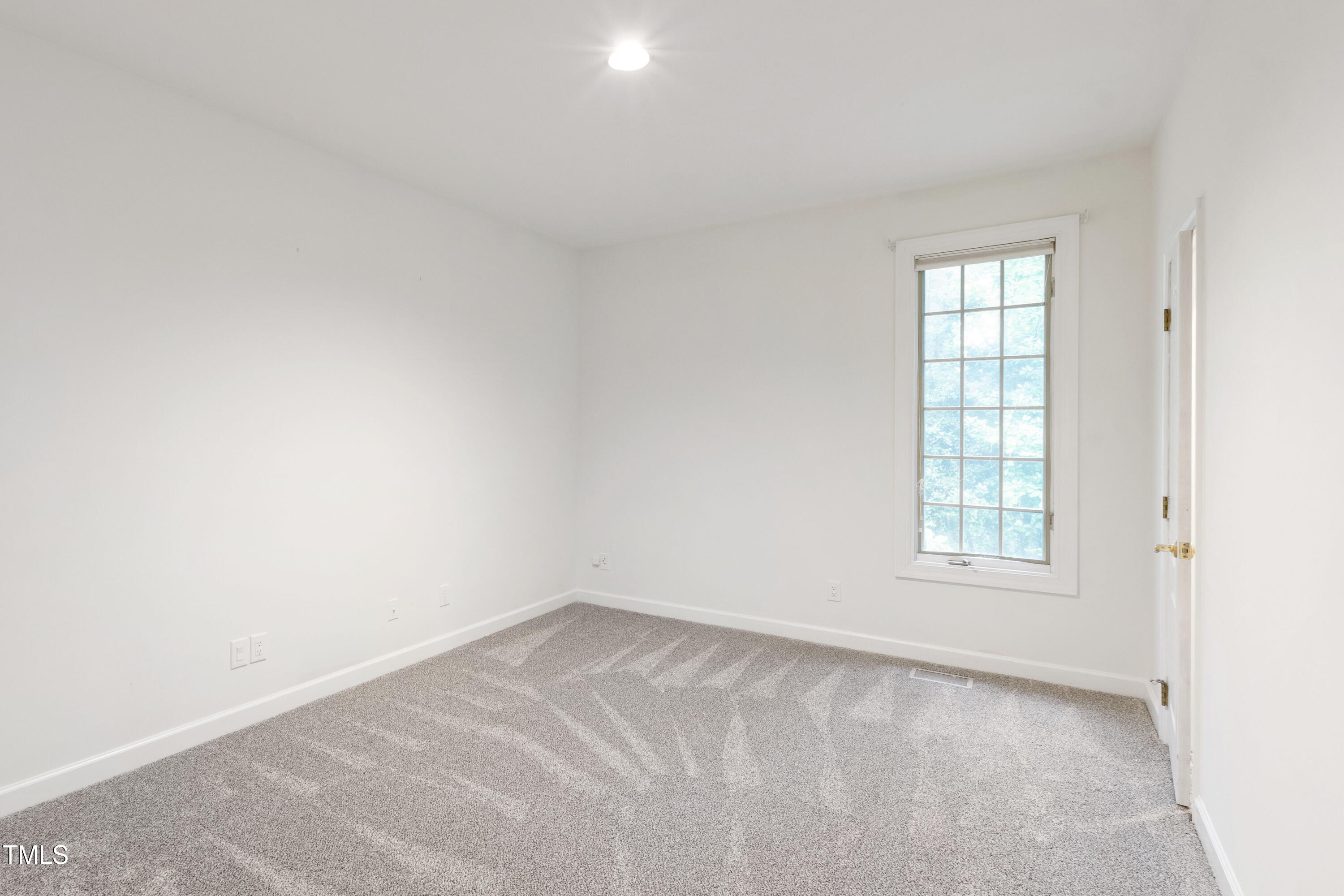 2517 High Ridge Drive Raleigh, NC 27606 - Photo 41 of 69 an empty room with a window