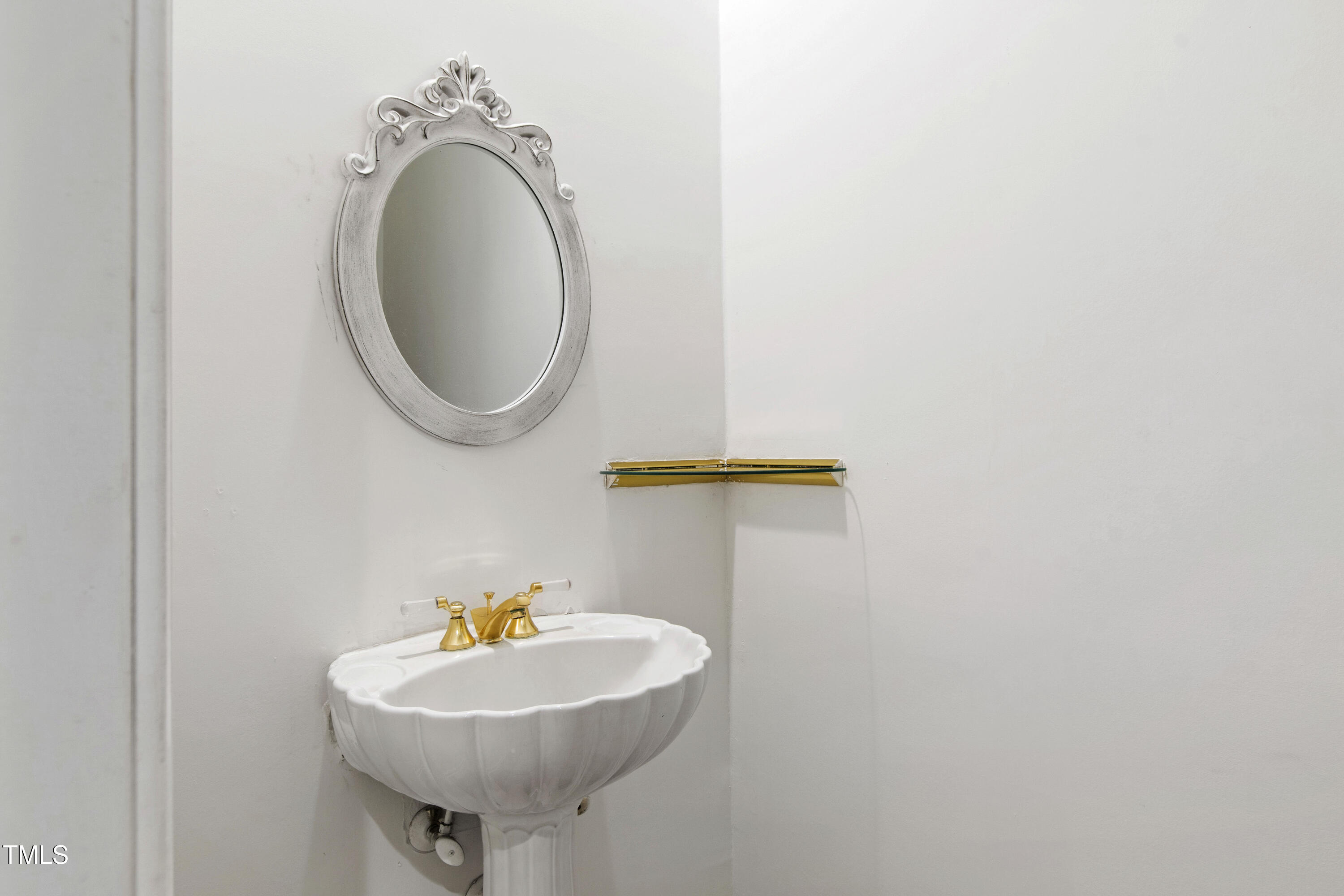 2517 High Ridge Drive Raleigh, NC 27606 - Photo 48 of 69 a bathroom with a sink a mirror and a toilet