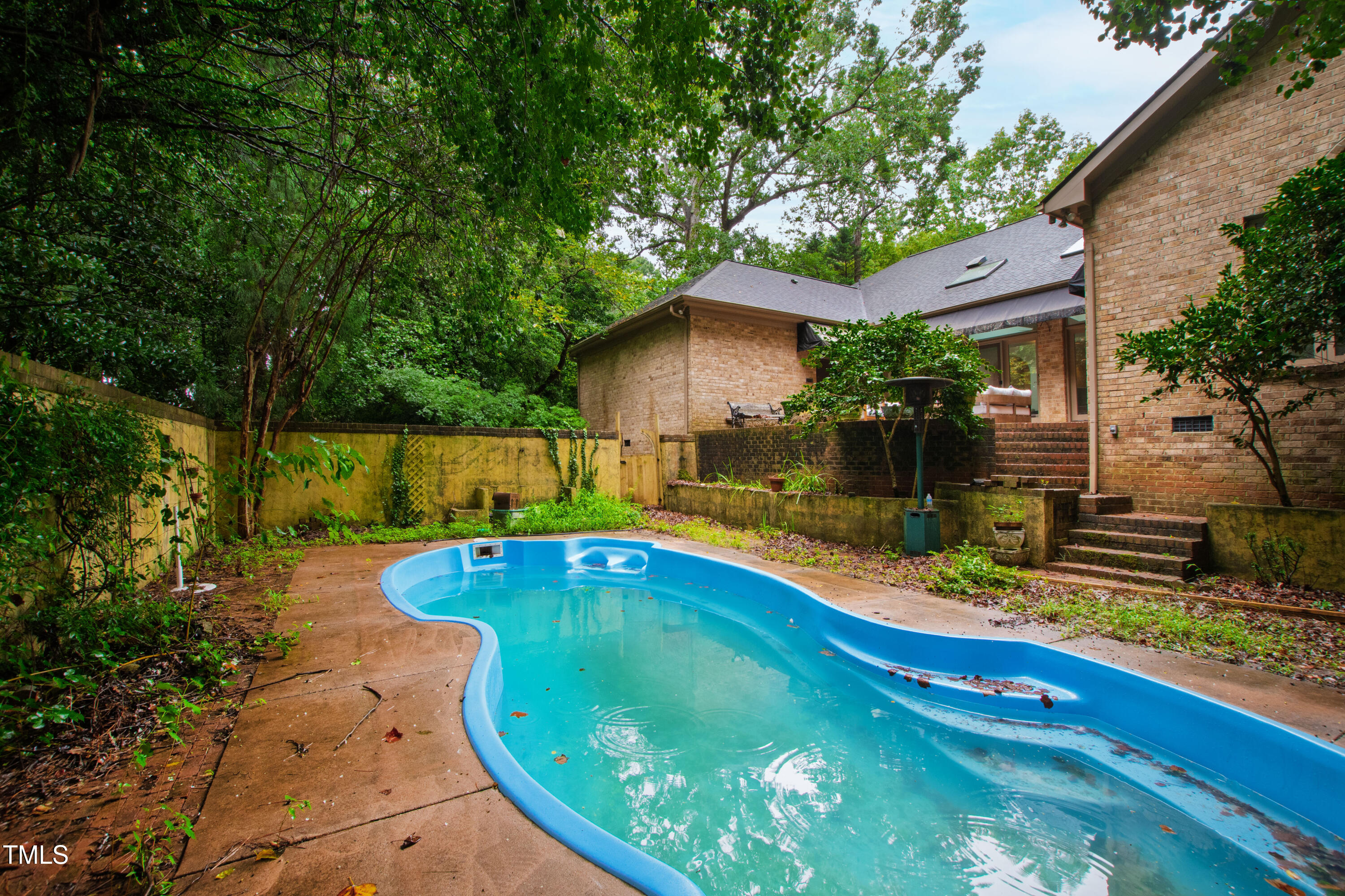 2517 High Ridge Drive Raleigh, NC 27606 - Photo 59 of 69 a view of a swimming pool with a patio
