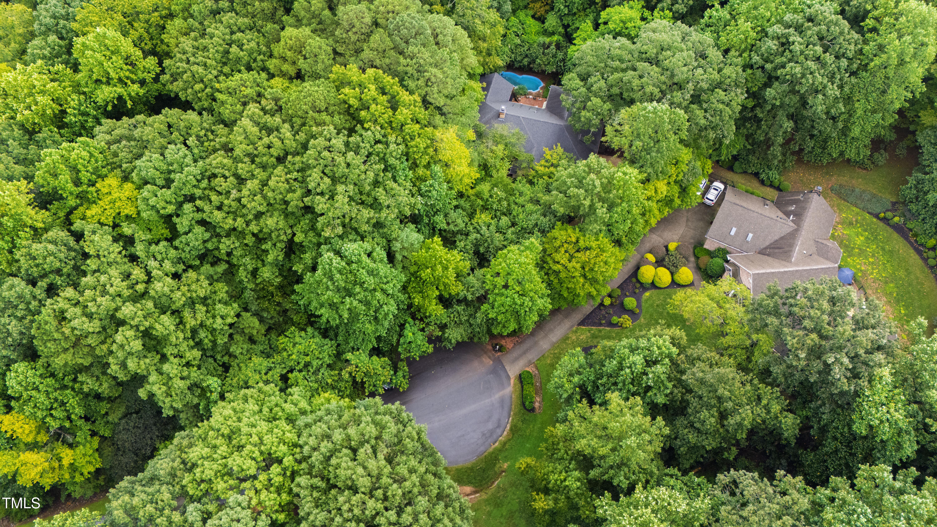 2517 High Ridge Drive Raleigh, NC 27606 - Photo 66 of 69 an aerial view of a house with a yard and large trees