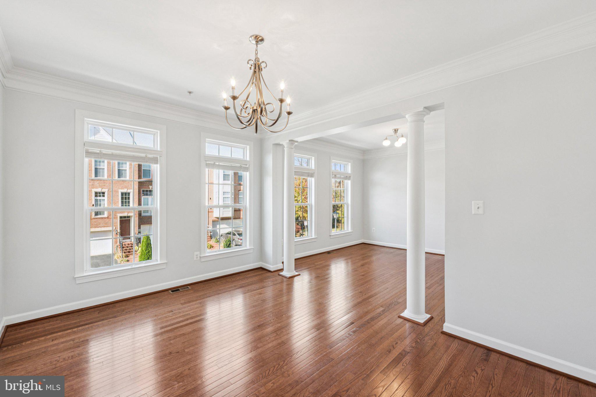 125 Autumn View Drive Gaithersburg, MD 20878 - Photo 14 of 38 a view of an empty room with wooden floor and a window