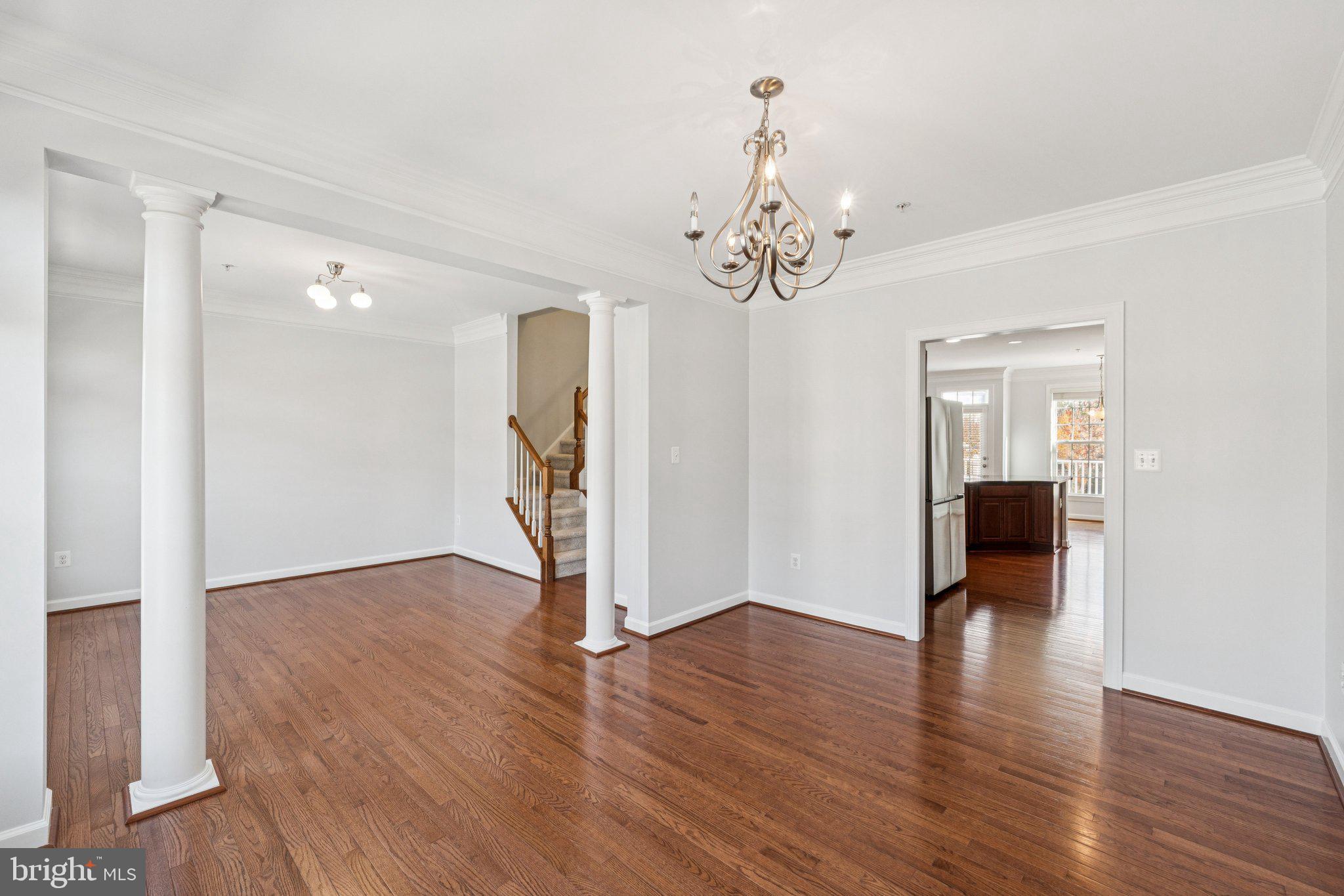 125 Autumn View Drive Gaithersburg, MD 20878 - Photo 15 of 38 a view of a livingroom with wooden floor and a ceiling fan