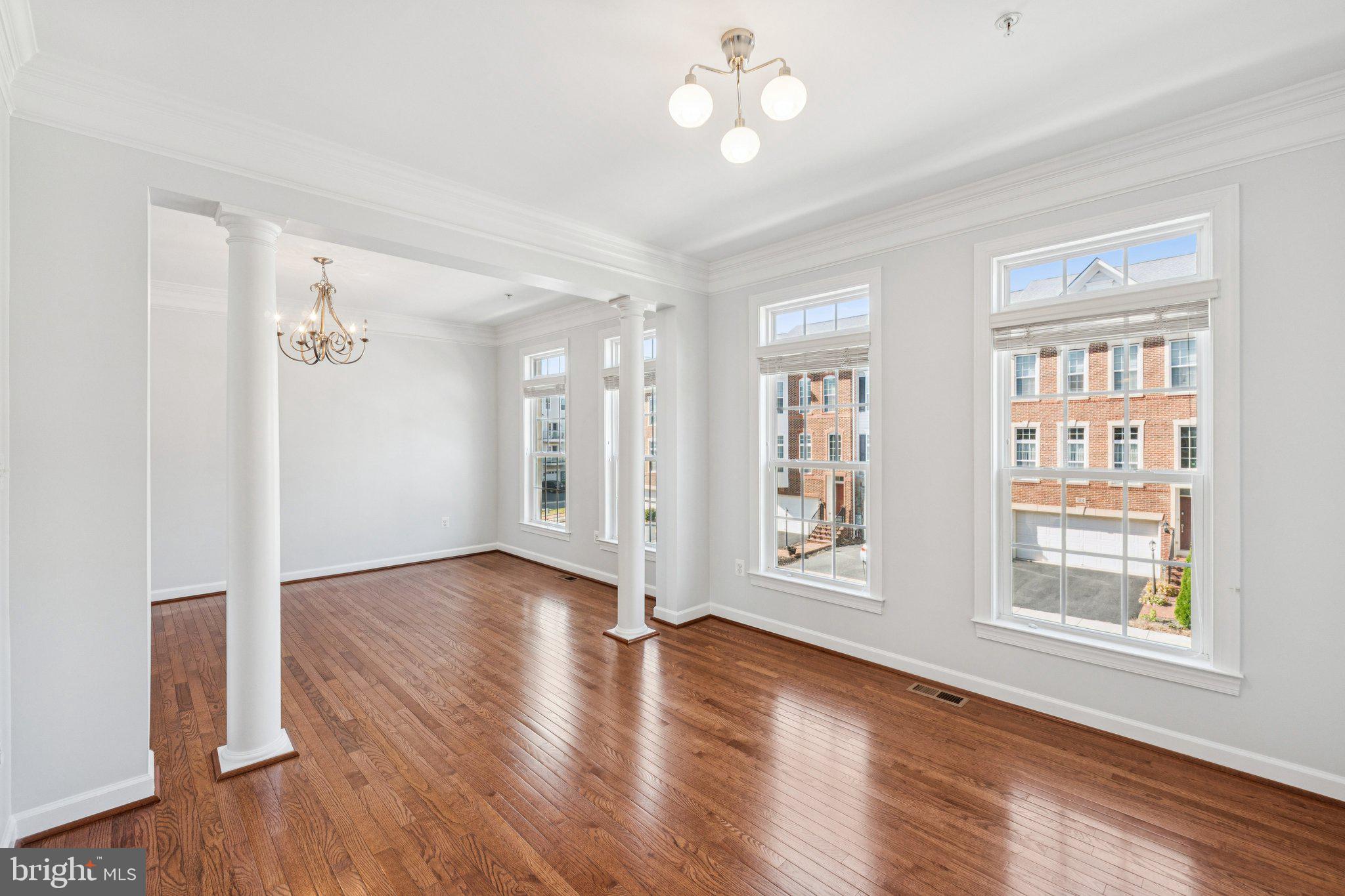 125 Autumn View Drive Gaithersburg, MD 20878 - Photo 16 of 38 a view of an empty room with a window and wooden floor