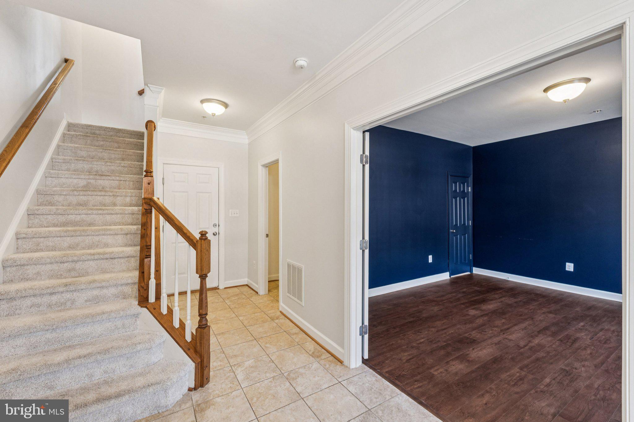 125 Autumn View Drive Gaithersburg, MD 20878 - Photo 31 of 38 a view of a hallway with wooden floor and staircase